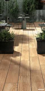 Outdoor Flooring For Gardens Minimalist And Inspired By Scandinavian Design Or Worn And Marked By Time The Wood Outdoor Flooring Patio Outdoor Tiles