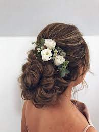 Classic Bridal Hair Style For A Traditional Bride Fresh Flowers Were Used To Tie The Whole Wedding Wedding Hair Up Bridal Hair Flowers Bridal Hair And Makeup