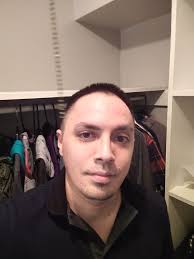 What guitar model has an RG body, hard tail style bridge, dot inlays, black  hardware, and a gloss black finish?