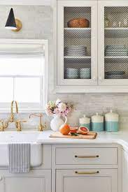 White glass cabinet doors and new gold kitchen cabinet hardware choices. House Update New Kitchen Cabinet Doors And Gold Kitchen Cabinet Hardware Choices Housere New Kitchen Cabinet Doors White Modern Kitchen New Kitchen Cabinets