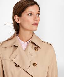 This trench coat has two front pockets and a fake belt detail in the back. Double Breasted Trench Coat Brooks Brothers
