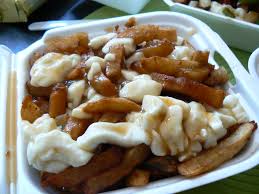 Layer caserole dish with fries. What Is Poutine Canadian Gravy Fries With Cheese Curds News Vdw