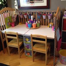We Upcycled Our Old Drop Side Crib Into An Art Desk Along With A Homemade Carousel For Markers And Such Kids Craft Tables Old Cribs Old Baby Cribs