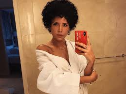 I always comb out the curls either with my fingers or a ladies who wear them regular how do you take the shine out of the fake hair and how do you make it not look like too much big hair? Halsey S Natural Hair