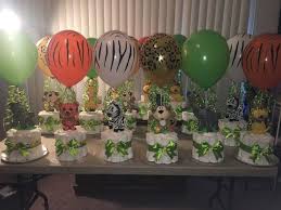 A simple display table with upright copies offers cute book themed baby shower decorations for the entryway to the party space. Baby Boy Jungle Theme Novocom Top