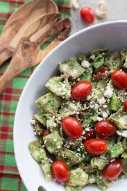 Add the pasta to vegetables and pour vinaigrette over all and mix lightly.source: Festive Pesto Pasta Salad Crumb Top Baking