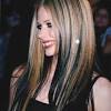 Avril lavigne shaves her head, dyes her hair pink and green. 3
