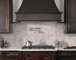 I love how there is more color variation within the tile than in the inspiration picture. Silver Travertine Herringbone Pattern Honed Backsplash
