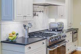 The top of the cabinet can be used for storage or display. What Are The Pros And Cons Of White Kitchen Cabinets Marble Com