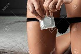 Condom In A Female Hand And Lowered Female Panties Close-up. Sexual  Foreplay, Contraception, Safe Sex Concept, Venereal Disease Protection  Stock Photo, Picture and Royalty Free Image. Image 159969140.