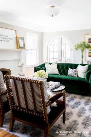 I am pretty sure that this sofa is emerald in color right? Emerald Green Velvet Tufted Sofa With Spindle Chairs Transitional Living Room