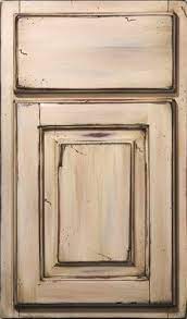 Unlike most refinishing projects, you can skip fixing any dents or minor damage to the cabinets before you start. Antique Cabinet Door Finish Refinish Ri Ma Distressed Kitchen Cabinets Distressed Kitchen Antique Kitchen