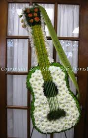 We offer a large variety of fresh flowers and gifts. Send Guitar Funeral Easel In San Antonio Tx From Stone Oak Florist The Best Florist Funeral Flower Arrangements Funeral Floral Arrangements Memorial Flowers