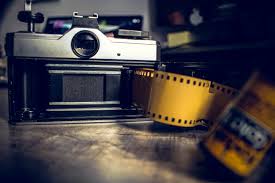 Warm, autumnal colors and clothing alternate with blue wasted spaces, but the message is the same. Vintage Camera Yellow Film Free Stock Photo Negativespace