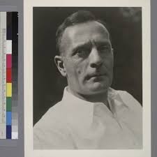 Portrait of Edwin Powell Hubble in a white collared shirt — Calisphere