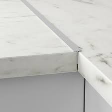 Unlike the usual flat grey finish, these cabinets have more character thanks to the horizontal grains of the wood panels. Kitchen Worktops Ikea