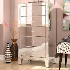 This stunning chest of drawers boasts shiny bevelled mirrored panelling throughout that is finished with a beautiful champagne gold trim. Gold Flamingo Briella 5 Drawer 24 W Solid Wood Lingerie Chest Reviews Wayfair