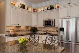 The material can be picked as ceramic, glass, or travertine. Tropical Brown Granite White Cabinets Ideas Photos Houzz