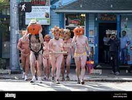 Oct. 31, 2010 - Seattle, Washington, USA - Nine runners participate in the  4th Annual Naked Pumpkin Run in Seattle's eccentric Fremont neighborhood.  Runners wore a combination of actual carved pumpkins, plastic