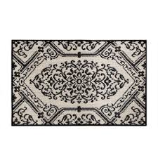 Get creative and place a black and white doormat on the front doorstep, and arrange an indoor rug with an inverted pattern in the same color scheme. Kitchen Mats Mats The Home Depot