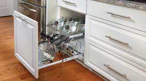 The top tier portion organizes the lids, while the bottom tier can hold a variety of pots and pans. Two Tier Cookware Organizer