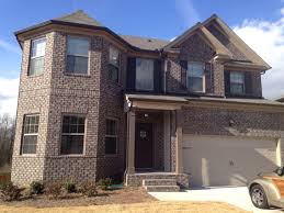 But if you're feeling bold, a confident candy apple red or vibrant turquoise can energize your gray brick facade in an instant. House Colors Gray Brick House Styles