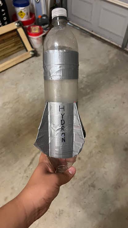 Not as impressive as standard rockets, but here is my favorite water bottle  rocket. It goes ~100 ft horizontally on 40 psi and half a liter of water.  It's surprisingly stable even