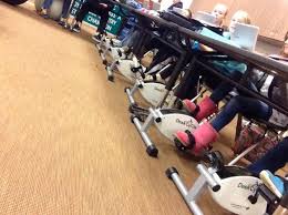 Under desk bikes have bicycle pedals. Children Using The Deskcycle