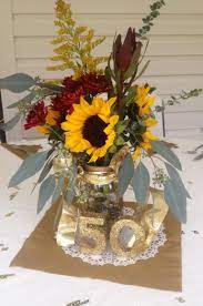 Although violets and yellow roses are the traditional flowers for a 50th wedding anniversary, you can give the couple other floral arrangements. Pin By Christy Malone Smith On Anniversary Wedding Anniversary Centerpieces 50 Wedding Anniversary Centerpieces 50th Wedding Anniversary Decorations