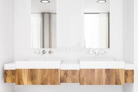 Wooden bathroom vanities do more than just housing the sink and offering storage. Close Up Of Wooden Bathroom Sinks Stock Illustration Illustration Of Faucet Mirror 151080275