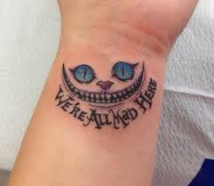 We Re All Mad Here Tattoo Idea Cheshire Cat Tattoo Foot Tattoos Tattoos