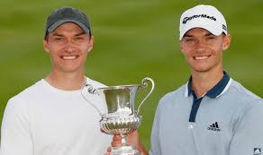 Nicolai hojgaard of denmark, right, smiles at his twin brother rasmus after winning the italian open golf tournament, in guidonia, in the outskirts of rome, . Ls Pulp5ykxusm
