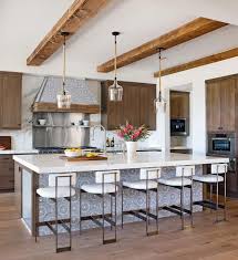 The dark gray material used for the cabinets contrast well with the gray painted walls and the textured strip tile backsplash. 25 Winning Kitchen Color Schemes For A Look You Ll Love Forever Better Homes Gardens