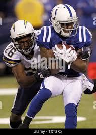 Indianapolis Colts wide receiver Brandon James (12) is tackled by San Diego  Chargers safety Pat Watkins (26) during the third quarter at Lucas Oil  Field in Indianapolis