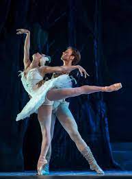 Silhouette photo of a young ballet dancer dressed in a long peach dress, pointe shoes with ribbons. Cuban Ballet Dancers In The World Lahabana Com