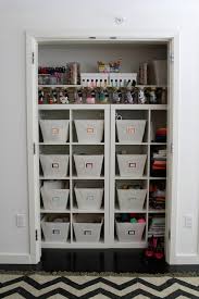 Kitchen features honed marble backsplash tiles over quartz countertop, white cabinetry and a light brown oak coffee cabinets with seeded glass chevron pattern doors. Ikea Closet System With See Through Drawers Transitional Closet