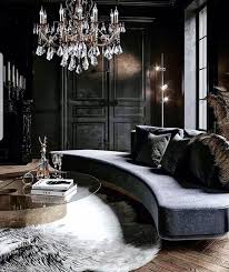 A chic gothic dining space with a dark table, heavy wood and burgundy velvet chairs and a vintage chandelier over the space. 30 Gothic Living Room Designs That Room More Cool Homemydesign