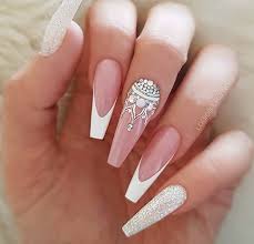 White And Pink Coffin Nails Nail And Manicure Trends These white coffin nails feature an exquisite snowflake on one nail of each hand.