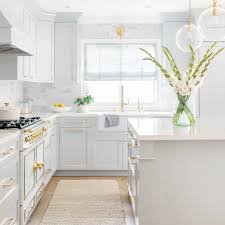 Black counters, white cabinets, stone flooring. 50 Best White Kitchen Design Ideas