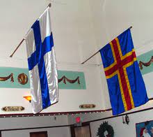It is the swedish flag defaced by a red cross symbolising finland.citation needed. Flag Of Aland Wikipedia