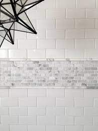 Don T Be Afraid Of Mixing Materials This Is Carrara With Ceramic Subway Tile The Pencil Helps Deal Bathrooms Remodel Bathroom Design Bathroom Tile Designs