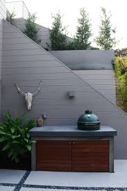 minimalist outdoor kitchen with green