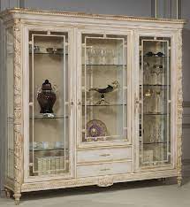 Maybe you would like to learn more about one of these? Casa Padrino Luxury Baroque Display Cabinet White Gold Noble Solid Wood Showcase With 3 Glass Doors And 2 Drawers Hotel Furniture Castle Furniture Luxury Quality