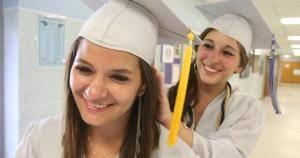 Oakcrest graduates 380 seniors amid thunderstorm