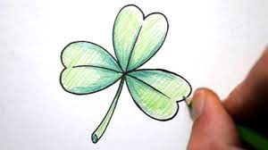 To draw a clover quickly and easily, sketch a long, curved arc for the stem. How To Draw A Shamrock Youtube