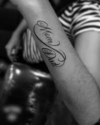 Memorial lettering tattoo for mom on forearm. 40 Mom And Dad Tattoos With Powerful Meanings Femina Talk