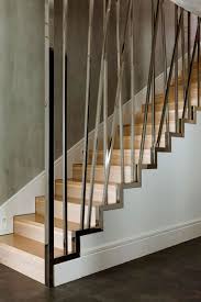 Minimalist Warsaw Duplex Exhibiting A Powerful Character Freshome Com Stair Railing Design Modern Staircase Railing Stairs Design Modern