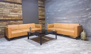 We have every style to suit the taste of your interiors. Modern Vintage Interior Living Room Brown Leather Sofa On White Parquet Flooring And Brick Wall Stock Photo Image Of Decoration Design 105221160