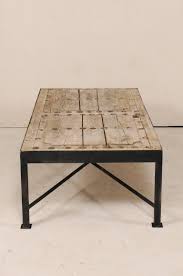 This coffee table is a wonderful addition to any patio space. 18th Century Spanish Wood Door Made Rustic Coffee Table With Custom Metal Legs For Sale At 1stdibs