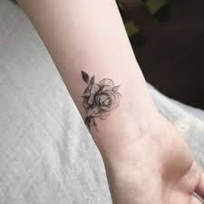 Classic black rose tattoo with great detail and shading; Rose Tattoo On The Wrist